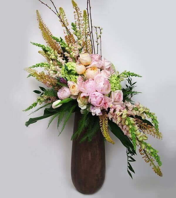 Rustic Love™ Bouquet - vase featuringpeonies, garden roses, hydrangea, tulips, snapdragons and eremurus are so nicely accented with cherry blossoms and lush foliage