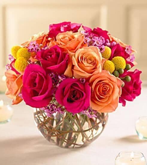 Sundance™ Bouquet - hot pink roses , orange roses , two-tone , golden craspedia , pink waxflower , vines , vase arrangement