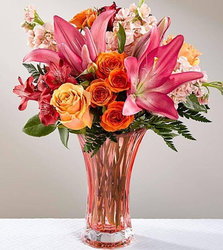 Touch of Spring® Bouquet - featuring peach roses, peach gilly flower, orange spray roses, red Peruvian Lilies and Pink Asiatic Lilies