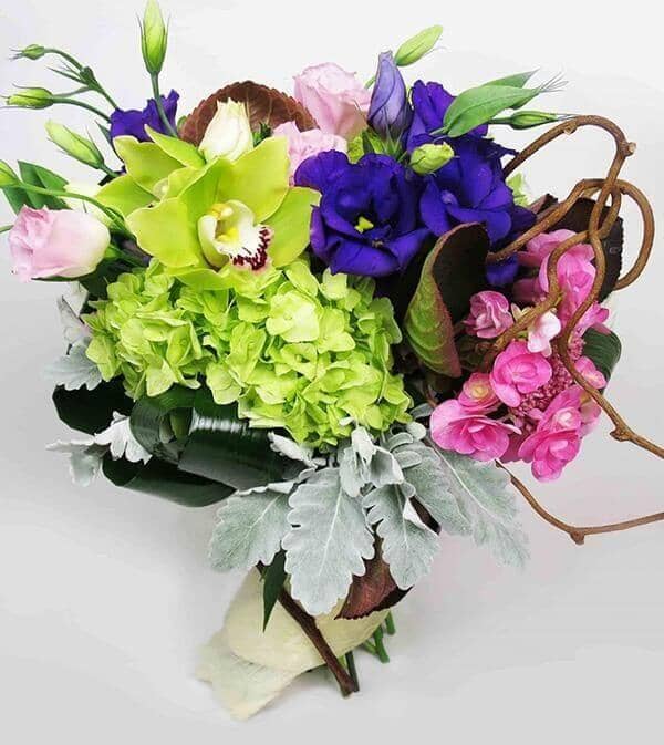 Corduroy™ Bouquet - bouquet with hot pink and zesty lime green hydrangeas, green orchids, purple and pink lisianthus, arranged with dusty miller, kiwi vines and lush foliage