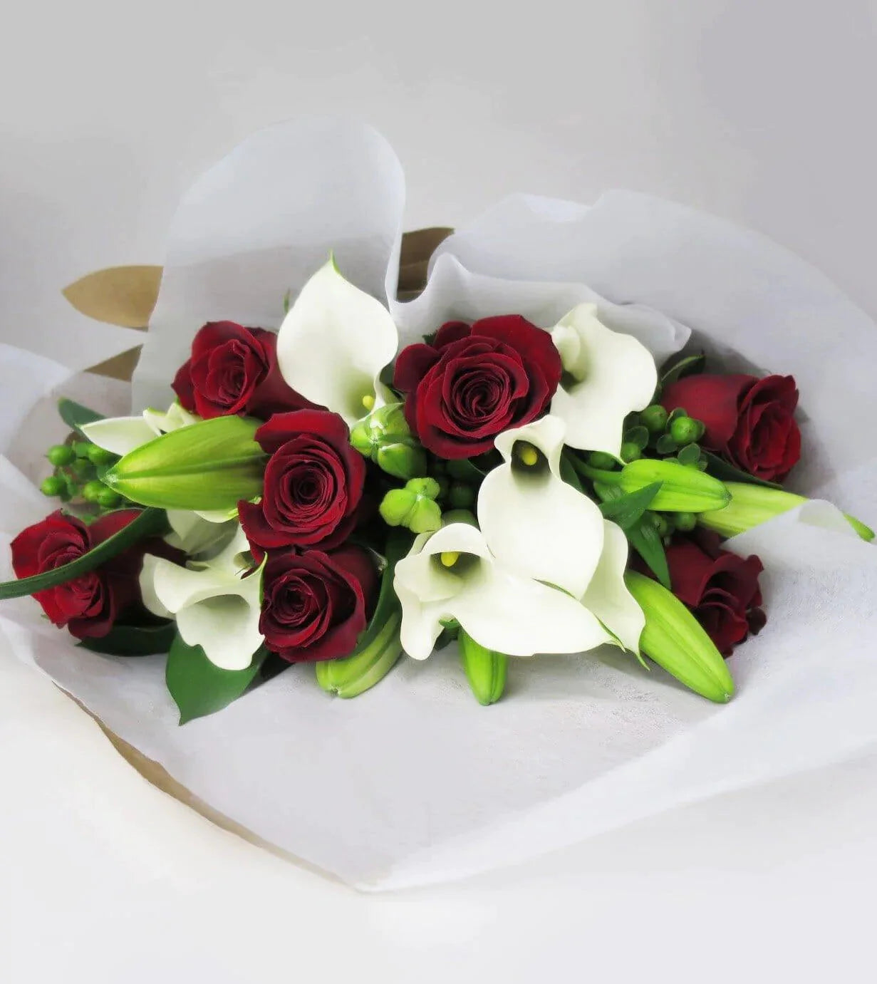 Grand Occasion Bouquet™ - bouquet with Red roses, white Mini Calla and Asiatic Lilies are arranged with Green Hypericum and Ruscus
