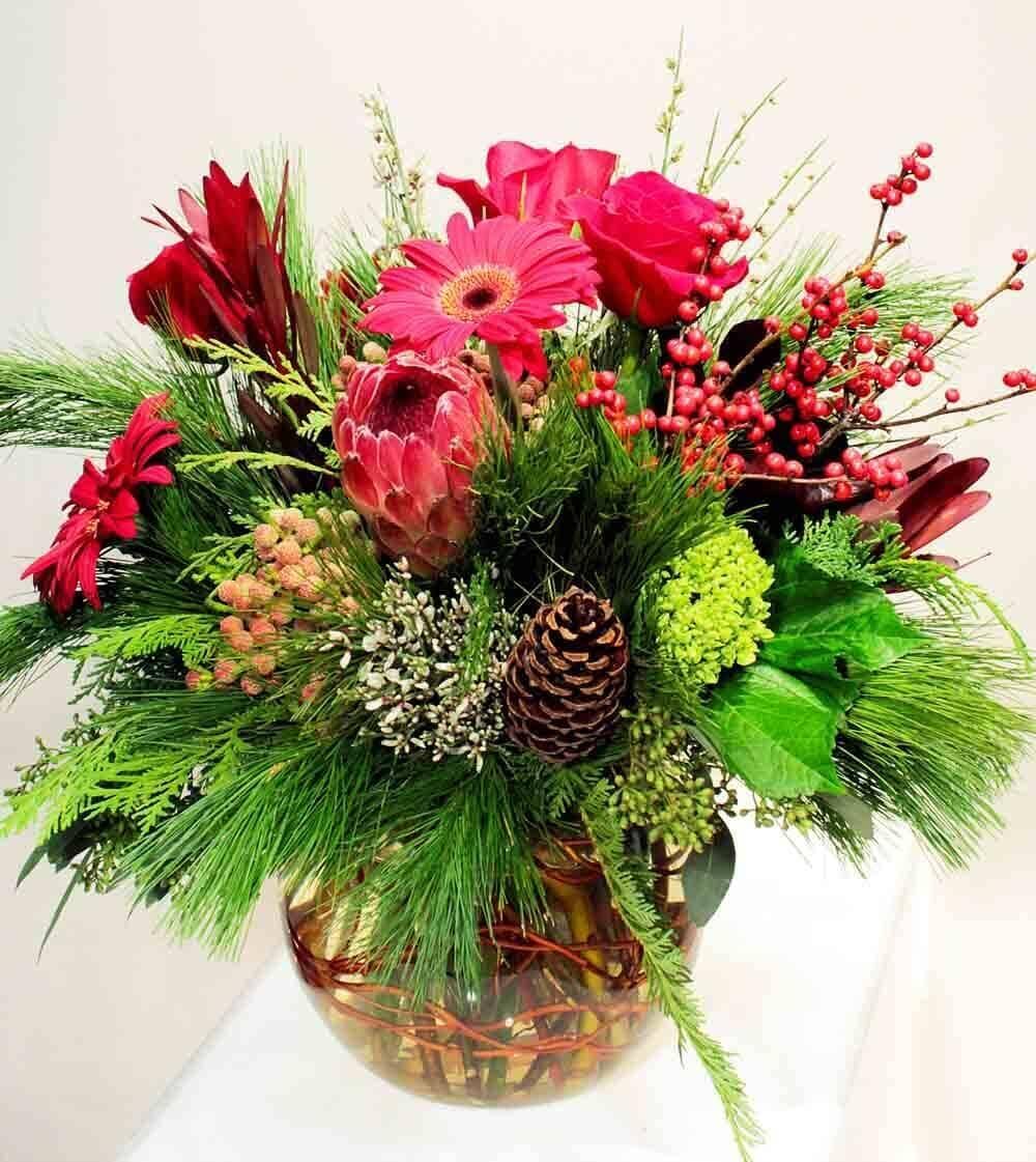Winter Beauty - Winter Beauty - vase with proteas, roses, gerbera, hydrangeas, lucedendron, genistra, assorted evergreens, pine cones, ilex and berzelia berries